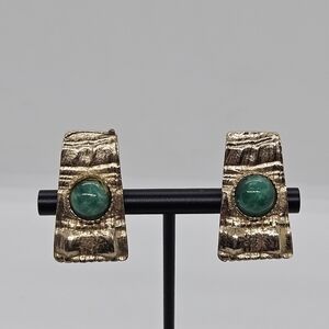 Reinad gold tone textured clip on earrings with green cabochons